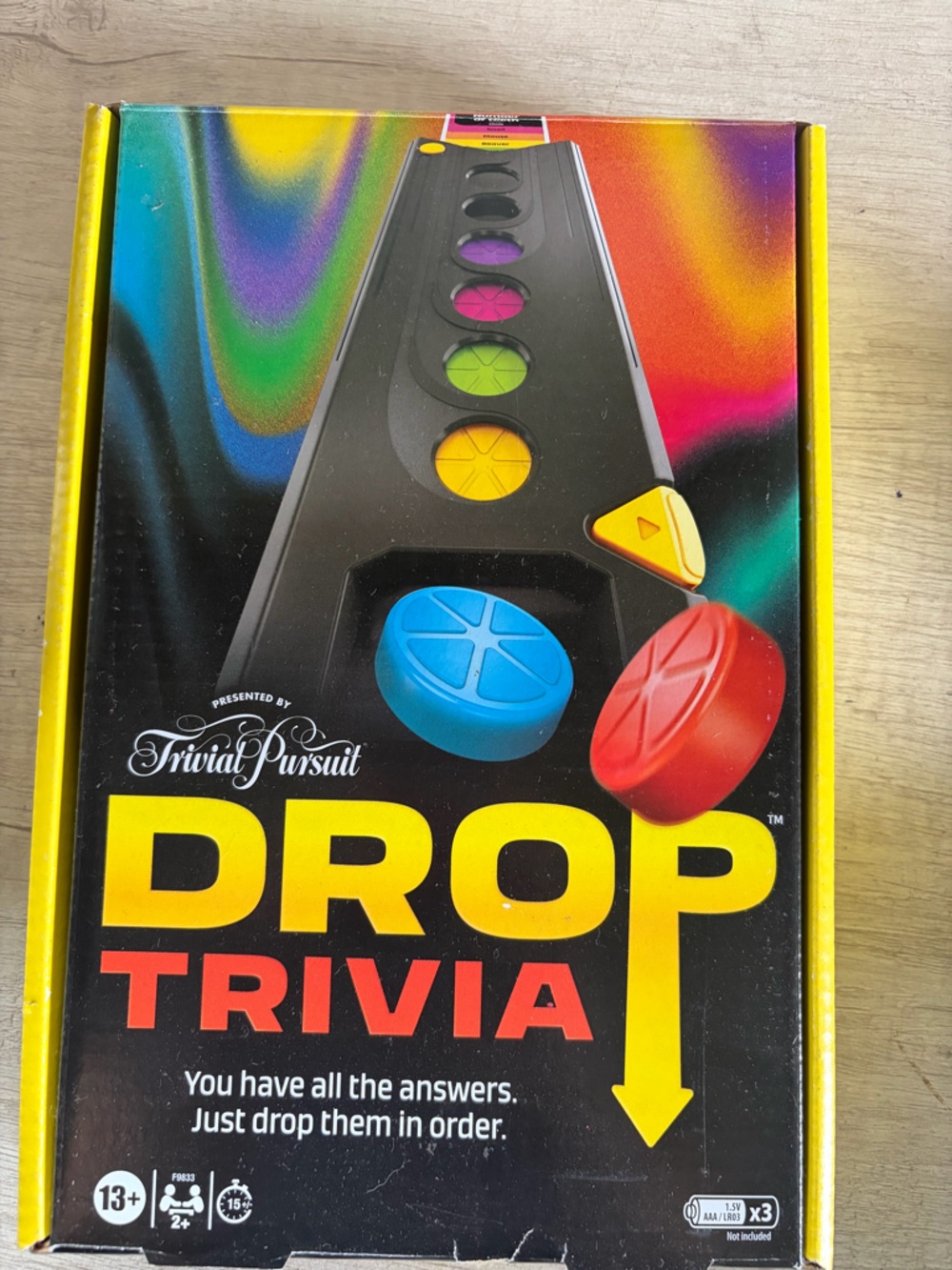 Trivial Pursuit Drop Trivia Board Game - Black with Multicolor Pieces